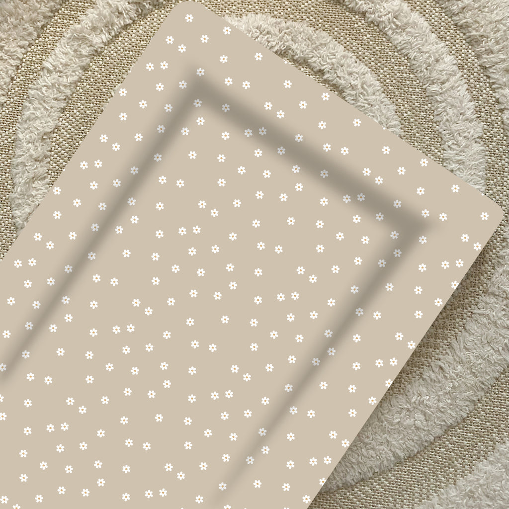 beige baby changing mat with dainty white daisies. Standard flat baby changing mat 
