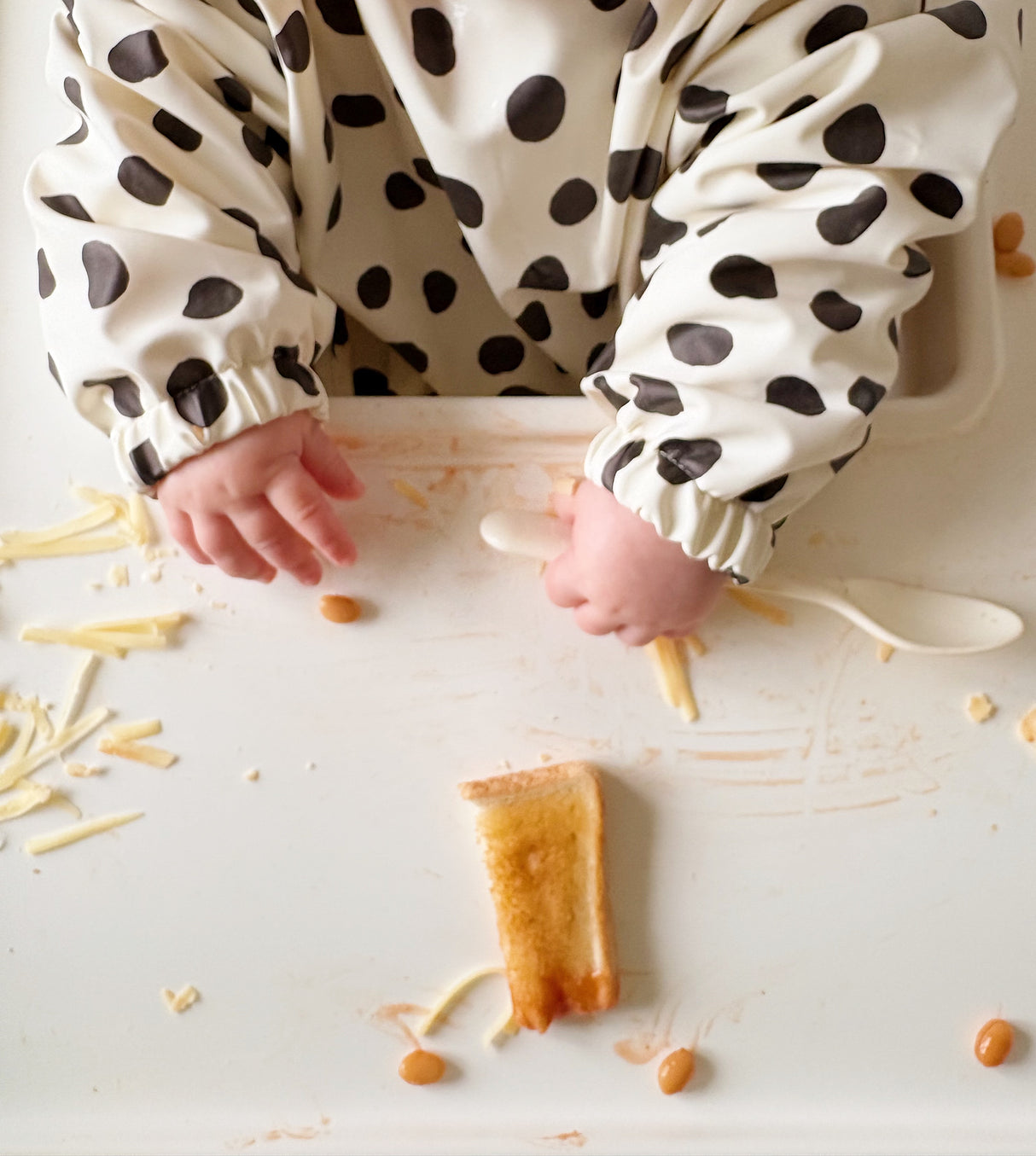 Long Sleeved Baby Bib - Spotty print