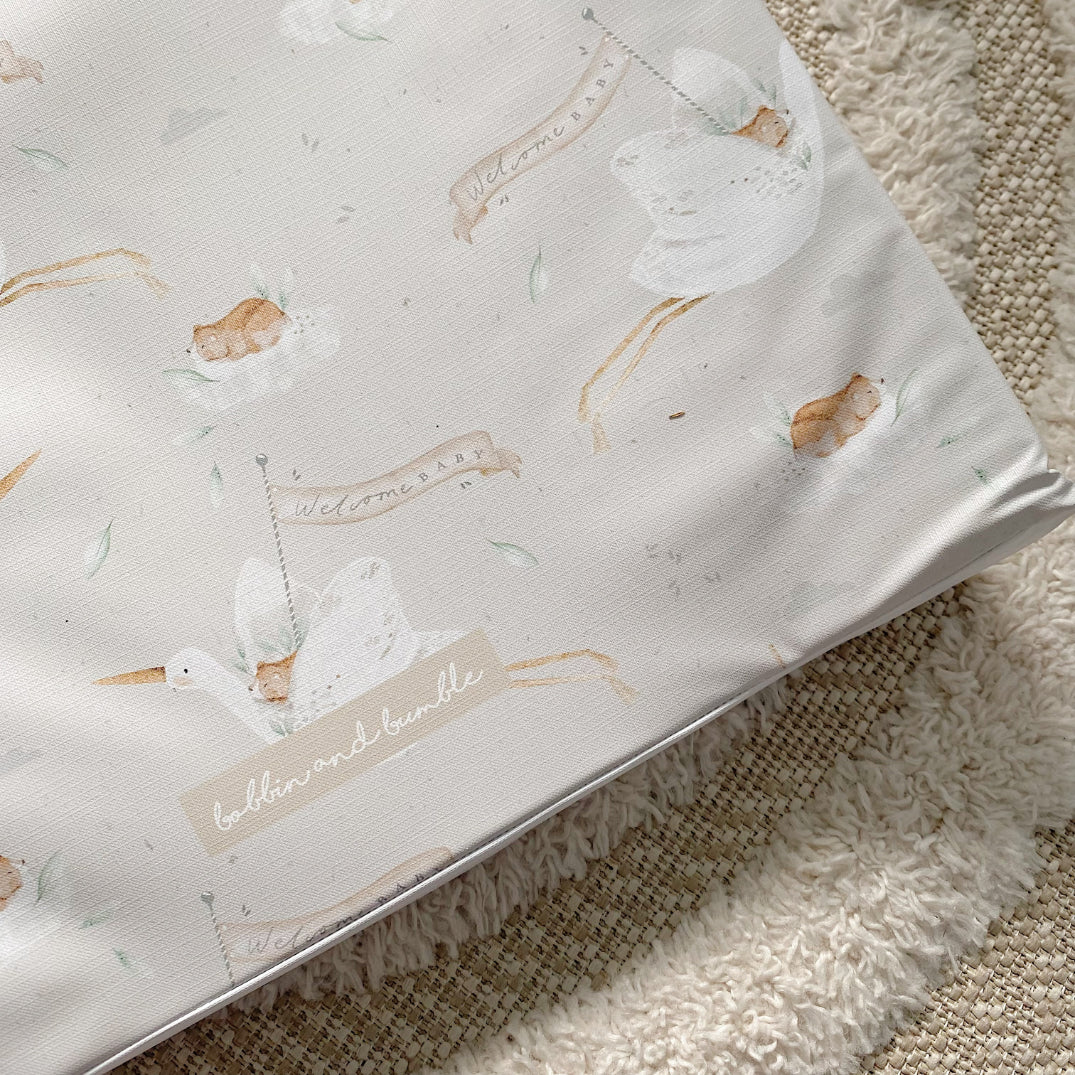 Anti-Roll Wedge Baby Changing Mat - Welcome Baby Print | Bobbin and Bumble.