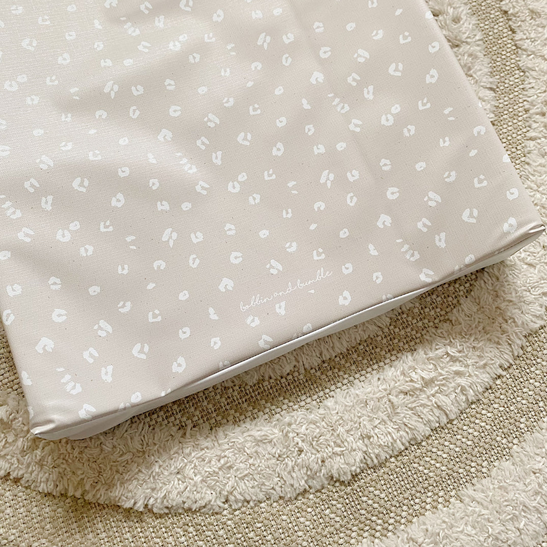 Anti-Roll Wedge Baby Changing Mat - Sand Animal Print | Bobbin and Bumble.