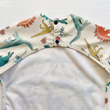 Long Sleeved Baby Bib - Dinosaur print | Bobbin and Bumble.