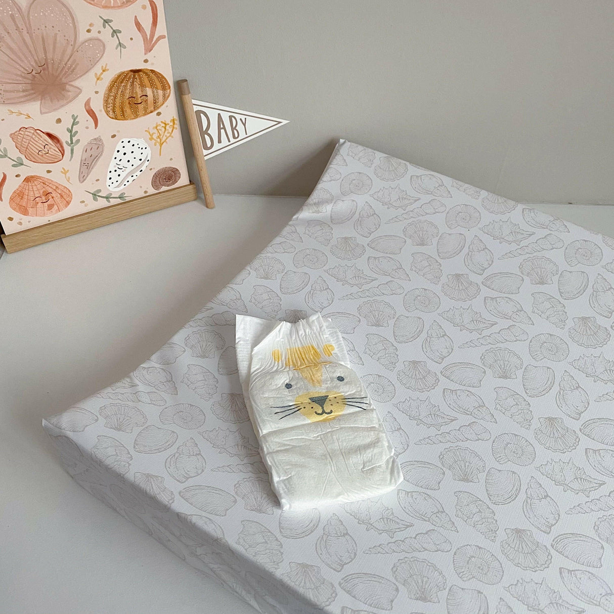 Anti-Roll Wedge Changing Mat - Delicate seashell print | Bobbin and Bumble.