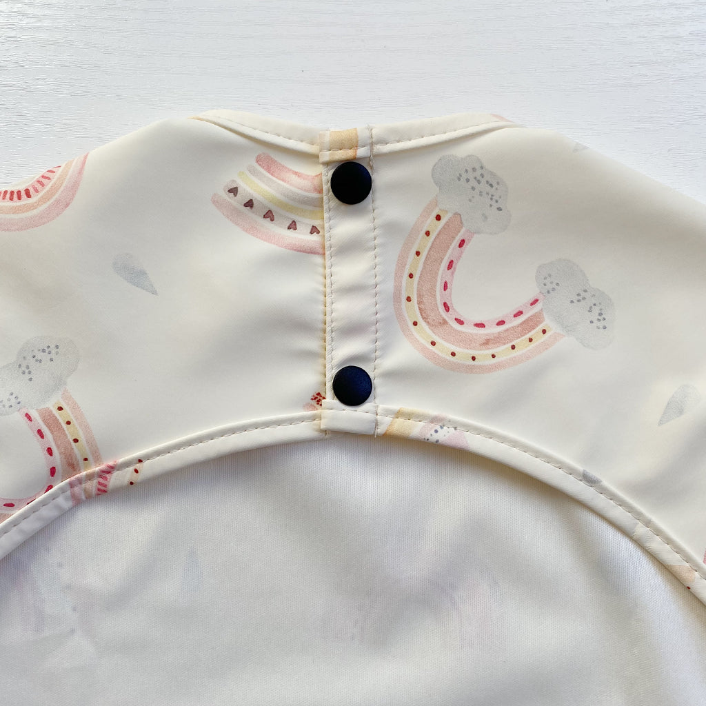 Long Sleeved Baby Bib - Rainbow print | Bobbin and Bumble.